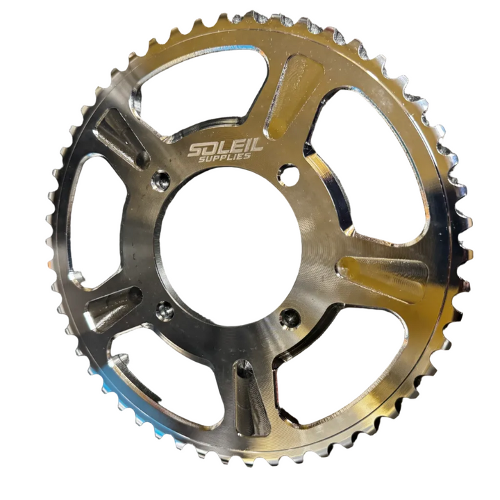 Sprocket with gold and silver finish on a white background