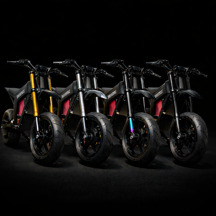 Four motorcycles in a row on a black background