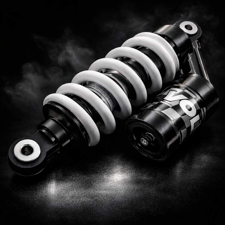 Motorcycle shock absorber with 'Yokohama' branding on a dark background
